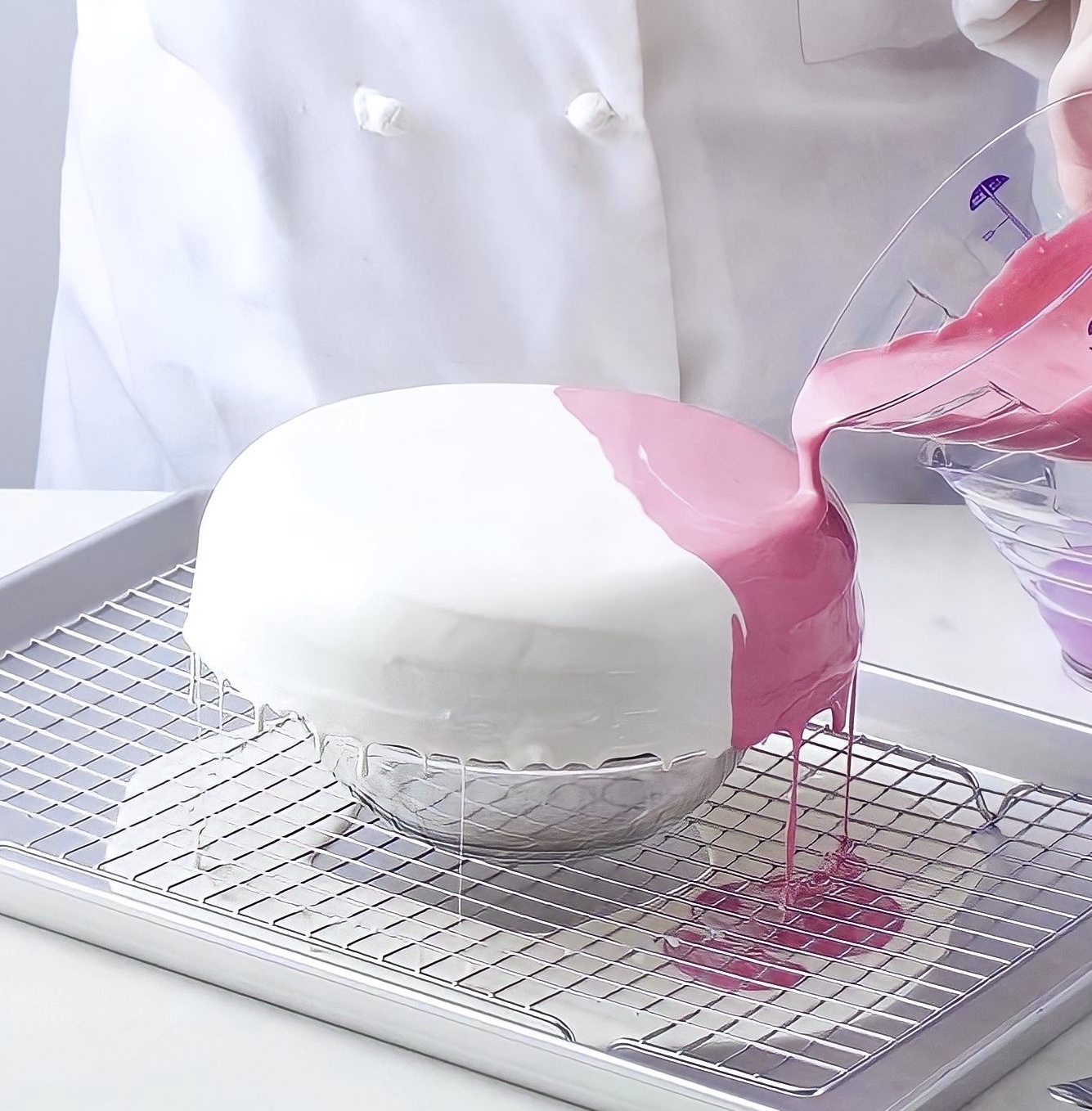 Marble glaze being poured over cake